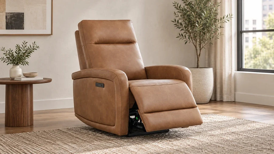 A tan Keni recliner with its footrest extended near a wall in a compact sitting area