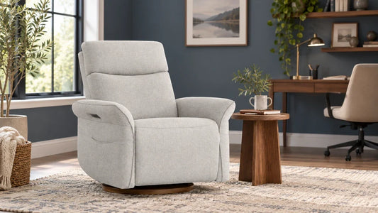 Light-gray Vinca recliner in a home-office reading corner beside a separate desk.