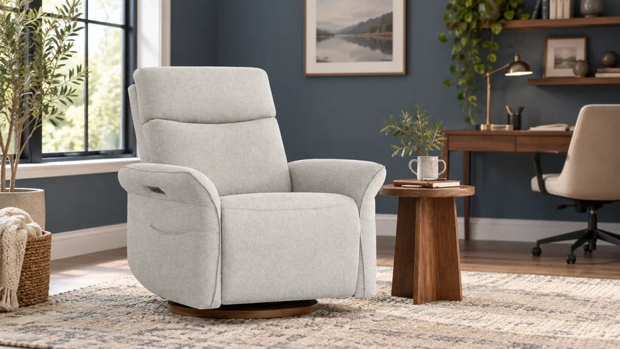 Light-gray Vinca recliner in a home-office reading corner beside a separate desk.