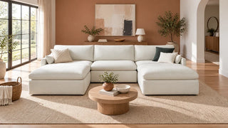 Ivory Kenna double-chaise sectional with a round coffee table