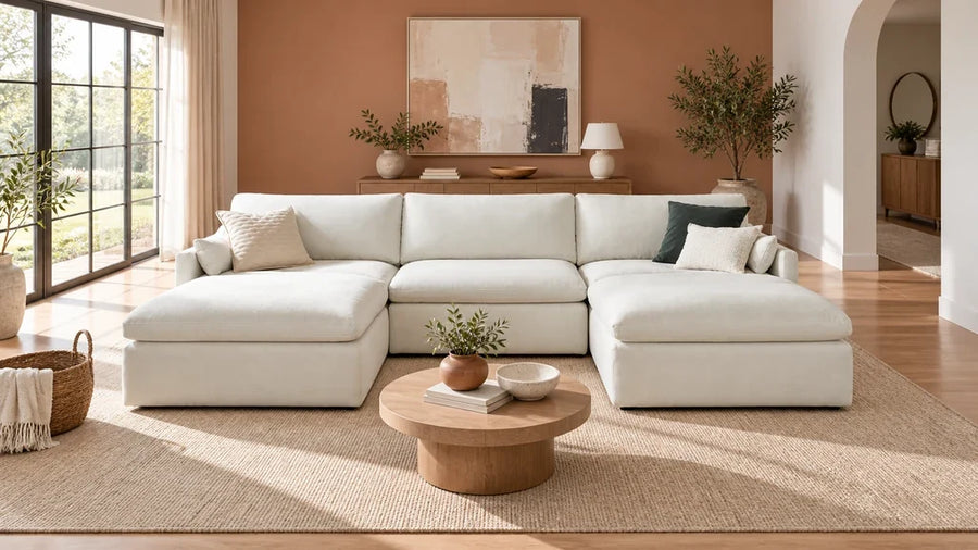 Ivory Kenna double-chaise sectional with a round coffee table