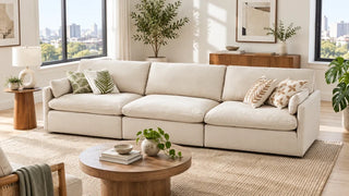 Cream Kenna three-seat modular sofa in a bright apartment living room.