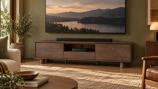 Dark oak Eason media console beneath a wall-mounted television.
