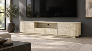 Aaron travertine-look media console below a wall-mounted television on a dark wall.