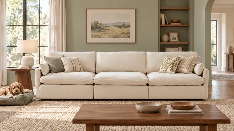 Cream Kenna three-seat sofa beside a dog resting in a separate pet bed