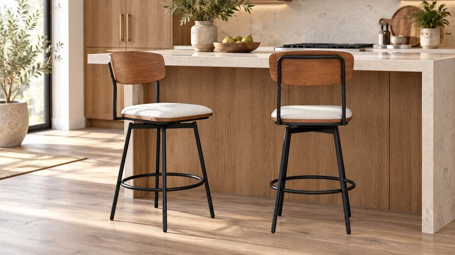 Two Aislinn counter stools with wood backs and pale upholstered seats at a light kitchen island.