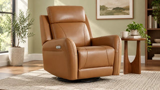 Caramel leather Myles recliner beside a wooden side table in a reading corner