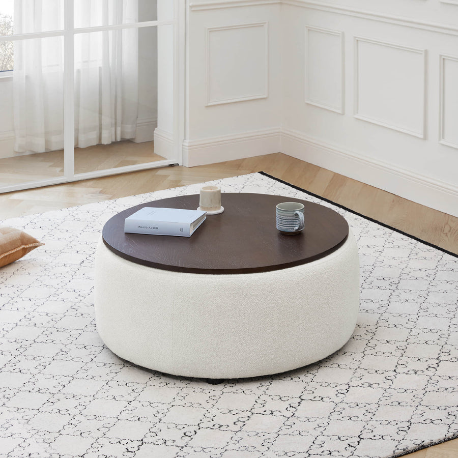 Grace round storage ottoman beside a sectional in a modern living room