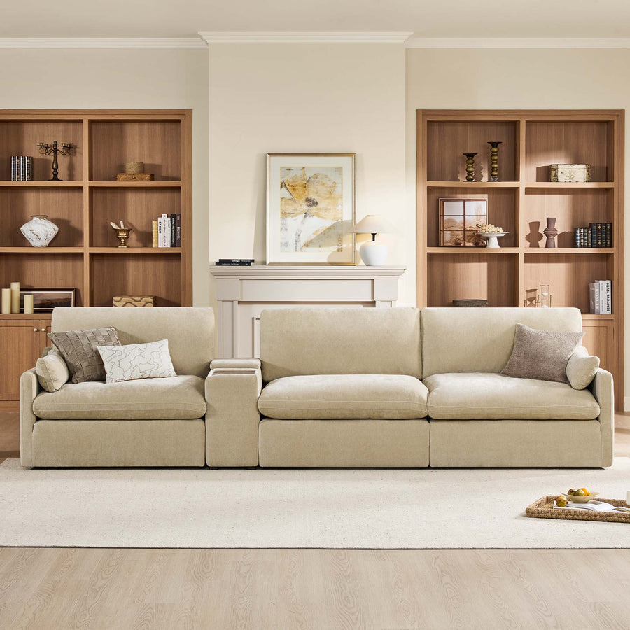 A cozy living room with a beige sofa, wooden shelves, and a framed picture on the wall.
