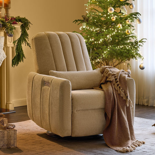 Cozy beige nursery glider recliner beside decorated Christmas tree creating warm festive holiday atmosphere in modern living room
