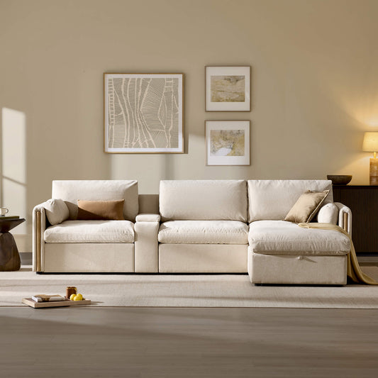 Light beige modular sofa with a chaise lounge and throw pillows in a modern living room.