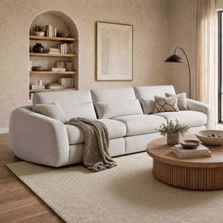 A broad living-room view introduces deep-seat sofas for relaxed family-room and home-theater use.