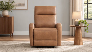 Tan Keni wall hugger recliner upright near a wall with open floor space in front