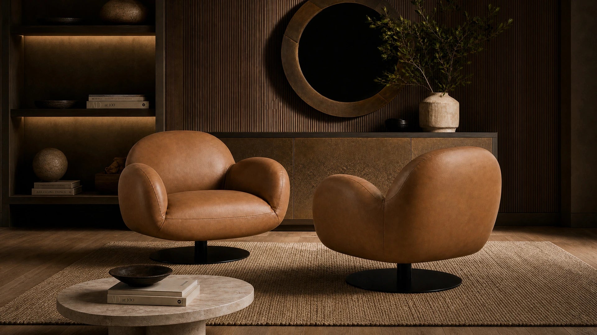 Two rounded tan leather swivel armchairs with black pedestal bases in a dark wood living room setting.