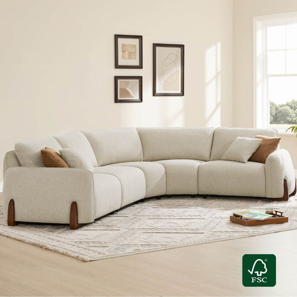 Cream 5-seat modular curved sofa with textured fabric and wood legs, showcased in a modern living room setting.