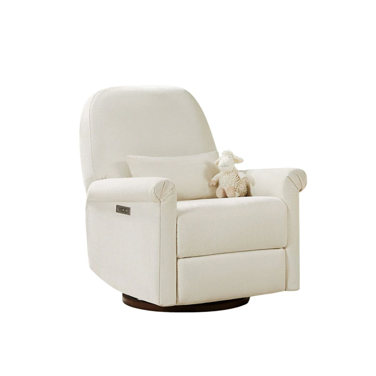 A white upholstered recliner with a plush sheep toy on the seat