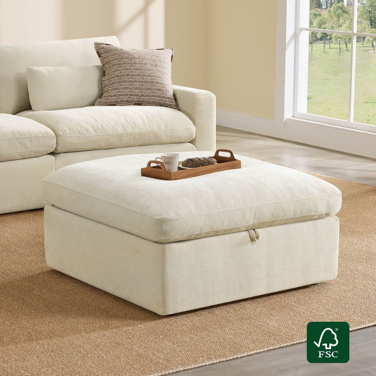 Cream performance fabric modular ottoman with storage, on jute rug. Includes wooden tray with mug and cookies.