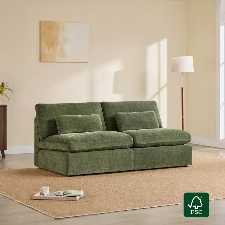 Green modular armless sofa with two plush cushions on a beige rug.