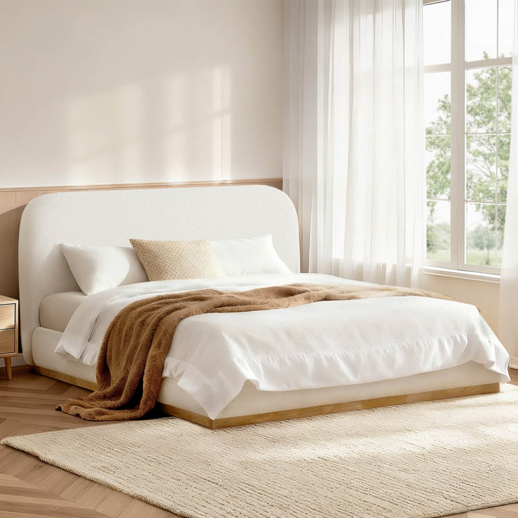 Kelda contemporary upholstered platform bed in white bouclé with rounded headboard and wood base.