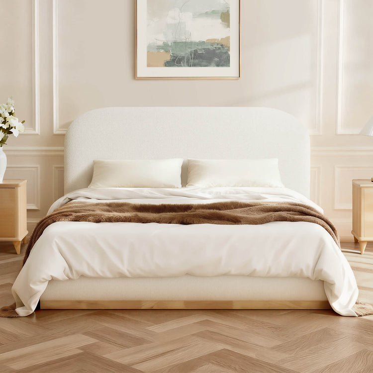 Kelda contemporary upholstered platform bed with rounded headboard and bouclé fabric in a bedroom setting.