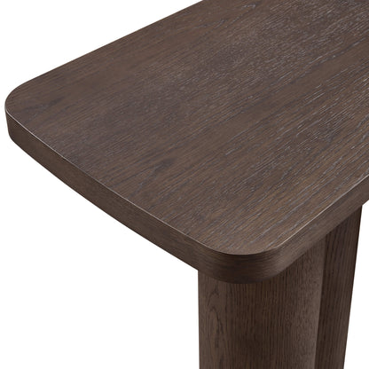 Dark brown oak wood console table surface and cylindrical leg detail.