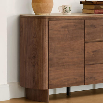 63" Chad Mid-Century Sideboard: walnut veneer, curved corner, travertine top. Integrated handle visible.