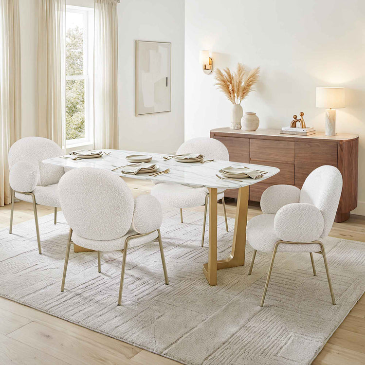 63" Teresa Marble Dining Table with U-shaped base and white boucle chairs.
