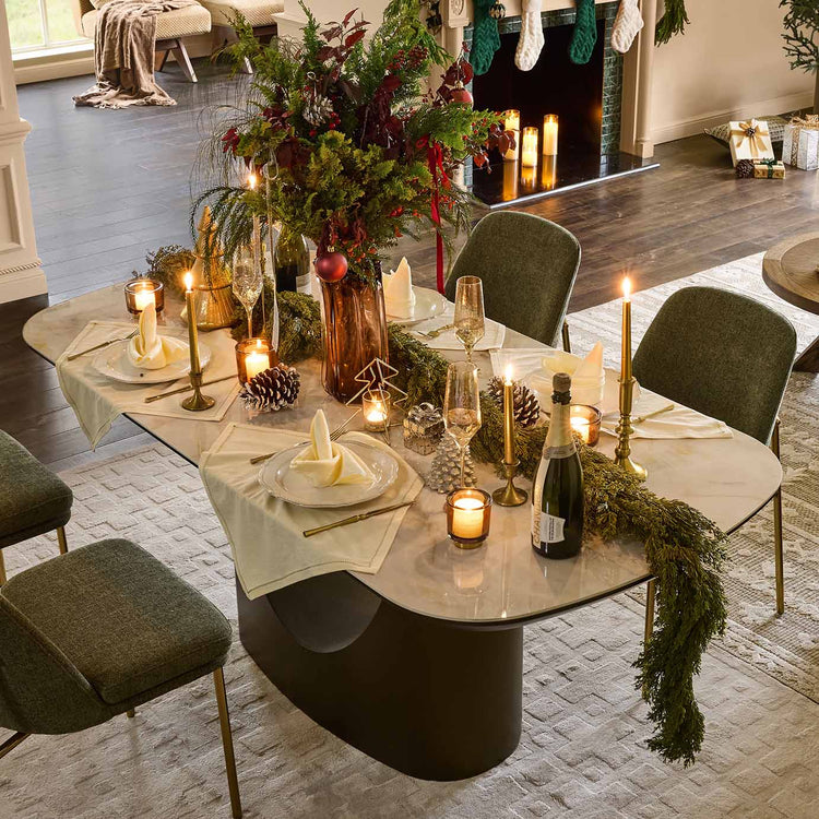 Layla 71" elegant sintered stone soft-corner dining table, festive scene.