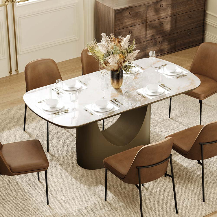 71” Layla Sintered Stone dining table with elegant soft corners and bronze sculptural base.