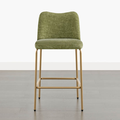 Green upholstered barstool with gold metal base and footrest