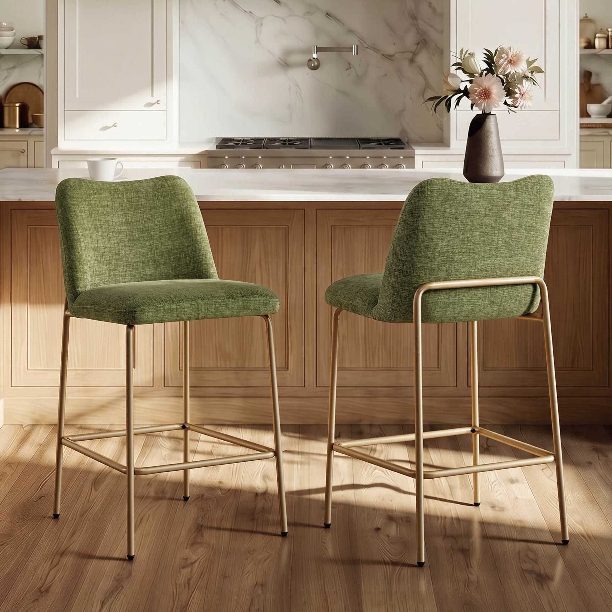 Green upholstered barstools with gold metal base in a modern kitchen