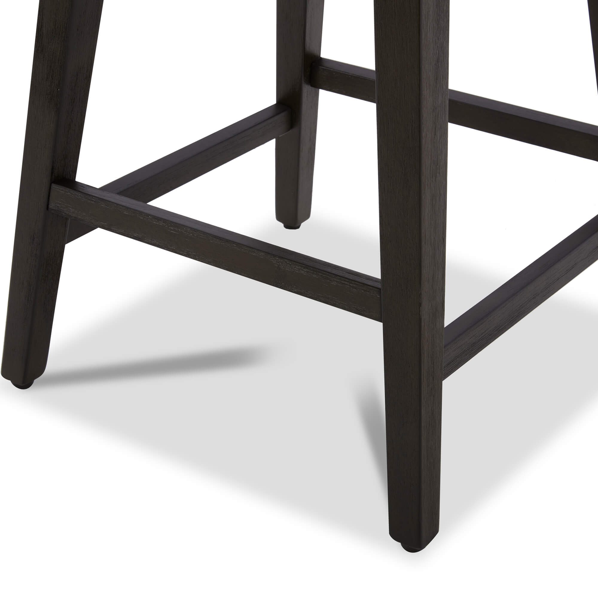 Close-up of Asher swivel bar stool's wooden legs and footrest detail - CHITA Living