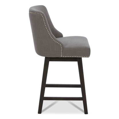 Asher swivel bar stool in gray fabric with silver nailhead trim, side view - CHITA Living