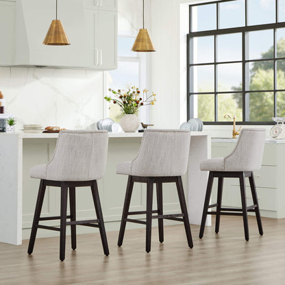 Asher swivel bar stools with gray upholstery and nailhead trim in contemporary kitchen - CHITA Living