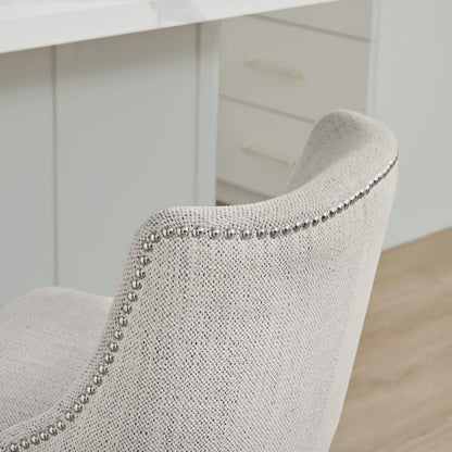 Close-up of Asher swivel stool in light gray fabric with silver nailhead trim - CHITA Living