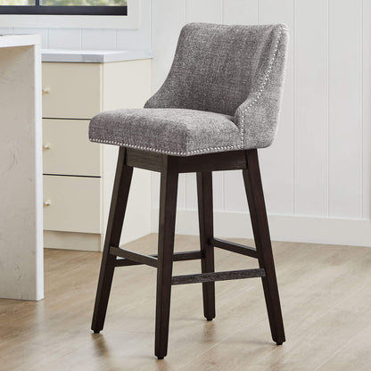 Gray Asher swivel bar stool with silver nailhead trim in contemporary kitchen setting - CHITA Living