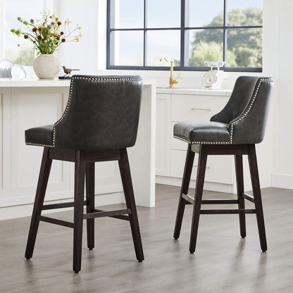 Dark gray Asher swivel bar stools with silver nailhead trim in modern kitchen - CHITA Living