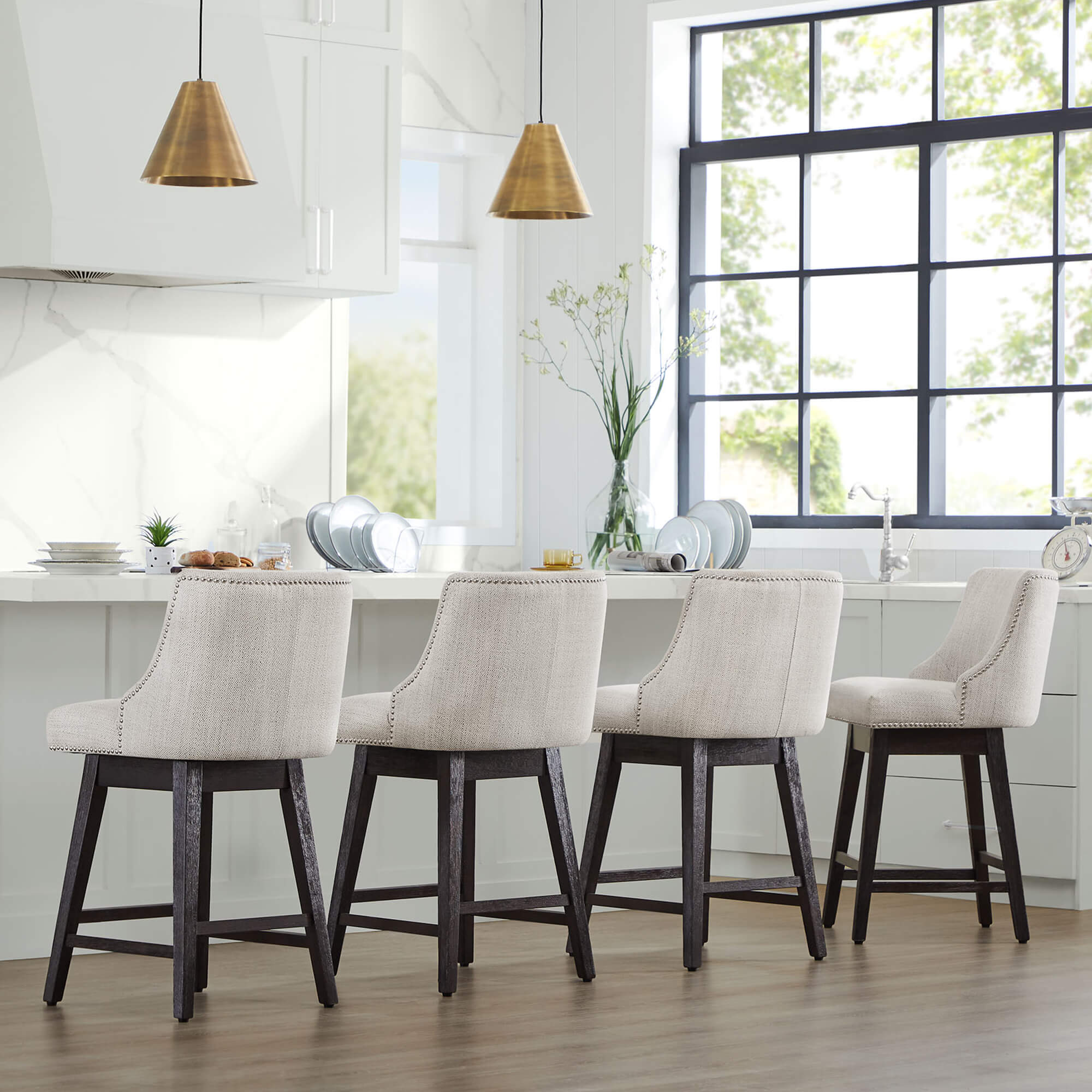 Asher swivel bar stools with nailhead trim in a stylish kitchen setting - CHITA Living