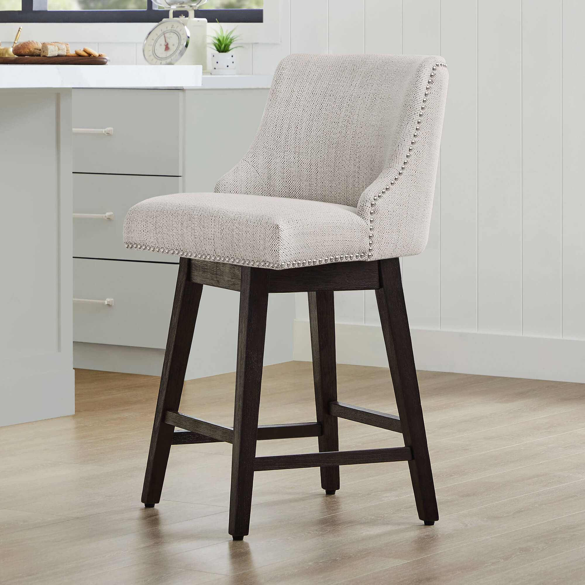 Asher swivel counter stool with nailhead trim in modern kitchen setting - CHITA Living