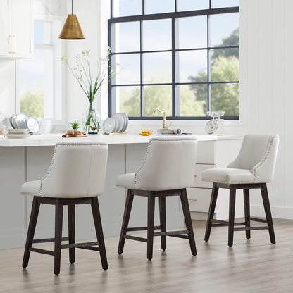 Asher swivel bar stools with white upholstery and silver nailhead trim in modern kitchen - CHITA Living