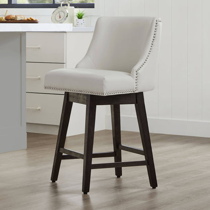 Light gray Asher swivel bar stool with silver nailhead trim in modern kitchen - CHITA Living