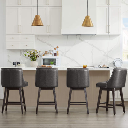 Asher swivel bar stools in dark gray upholstery with silver nailhead trim at a modern kitchen island - CHITA Living