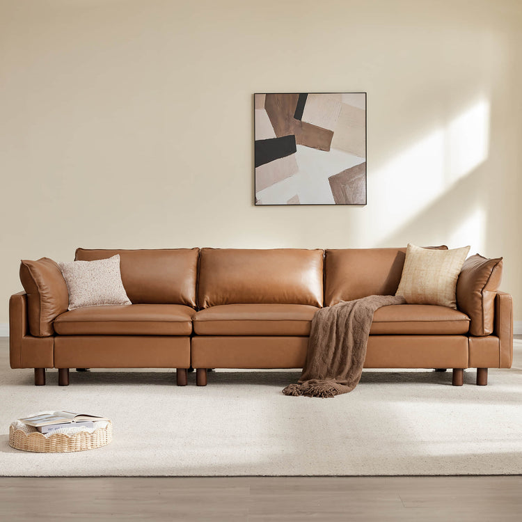 Brown modular 3-seat leather sofa with wood legs and decorative pillows.
