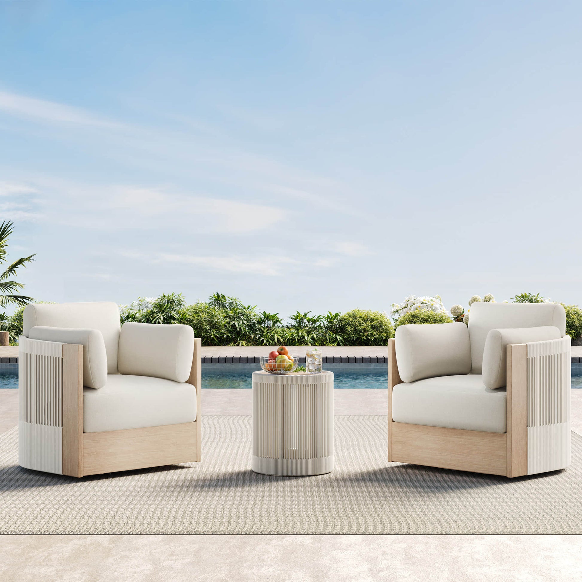 Clover Acacia Wood Woven Outdoor Bistro Set with Swivel Chair, poolside with a side table and fruit.