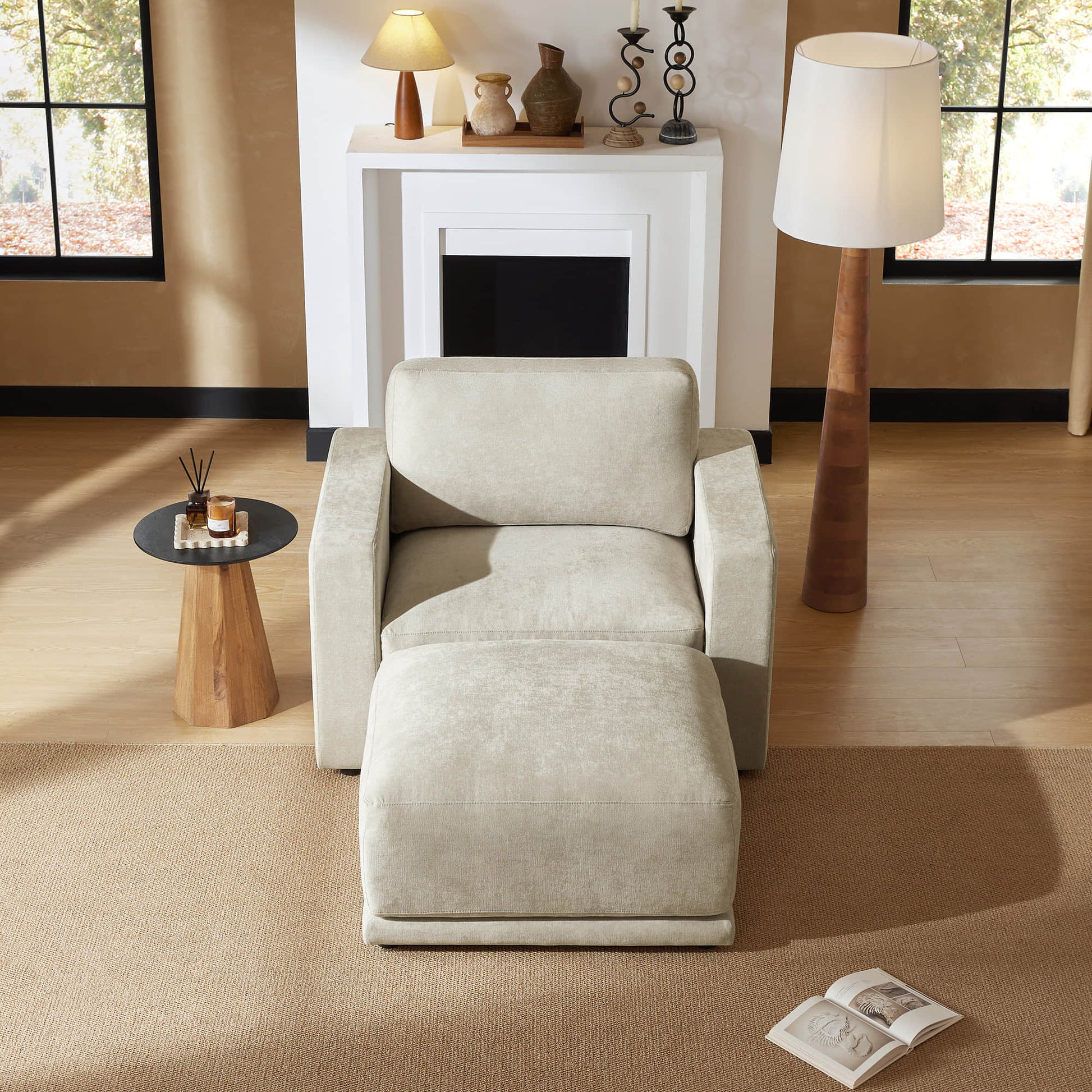 Plush armchair with a matching ottoman, perfect for relaxation in a cozy corner