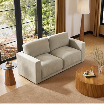 Comfortable two-seater sofa with a decorative pillow, adding a touch of style