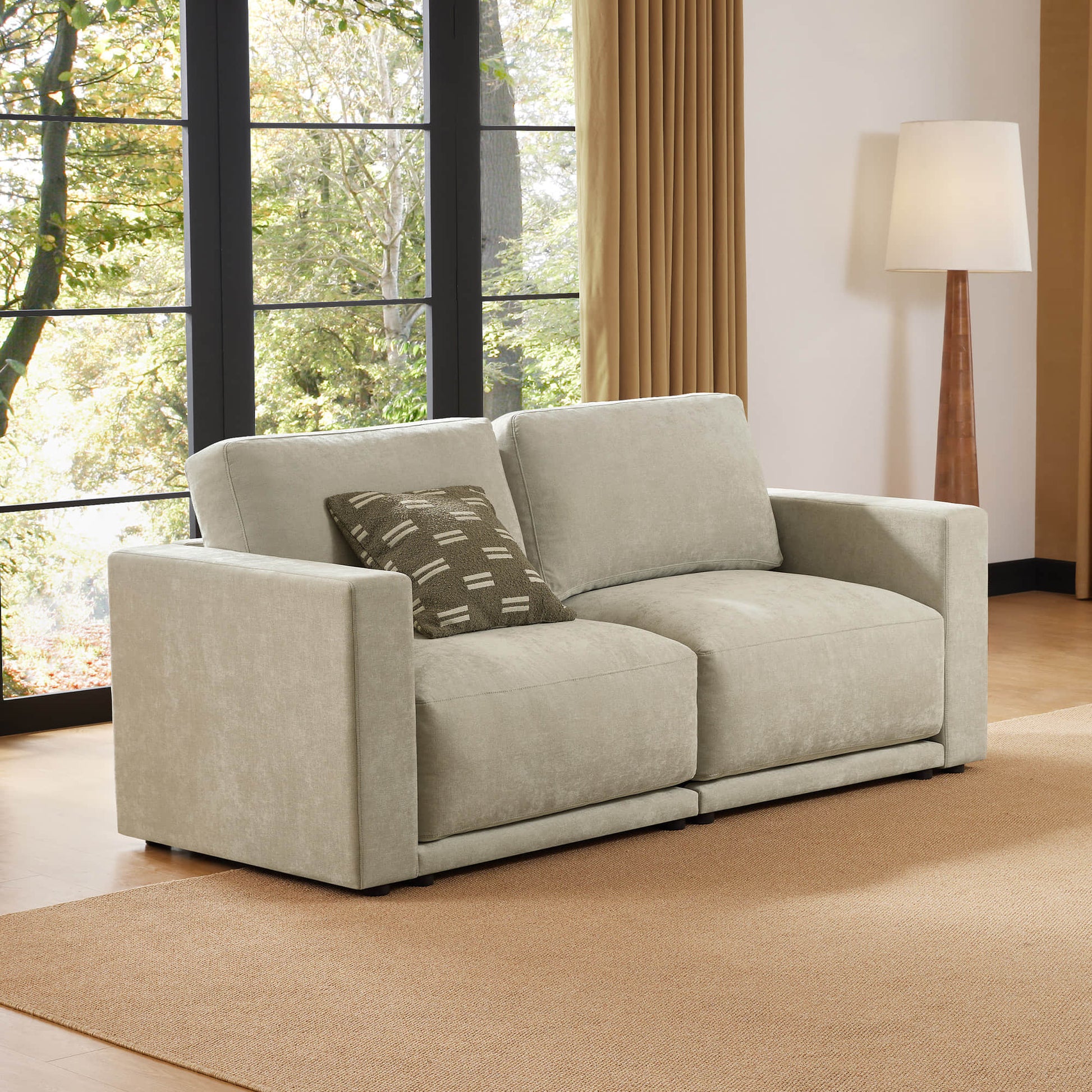 Cozy two-seater sofa in a modern living room with a natural view
