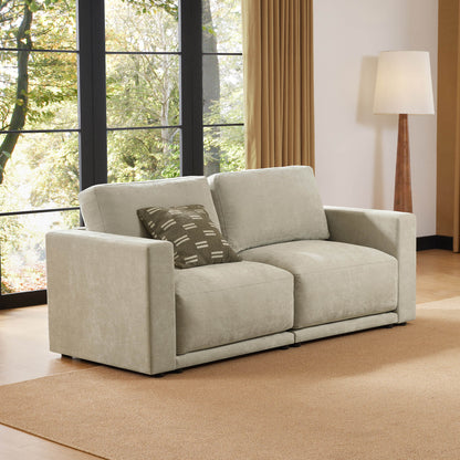 Cozy two-seater sofa in a modern living room with a natural view