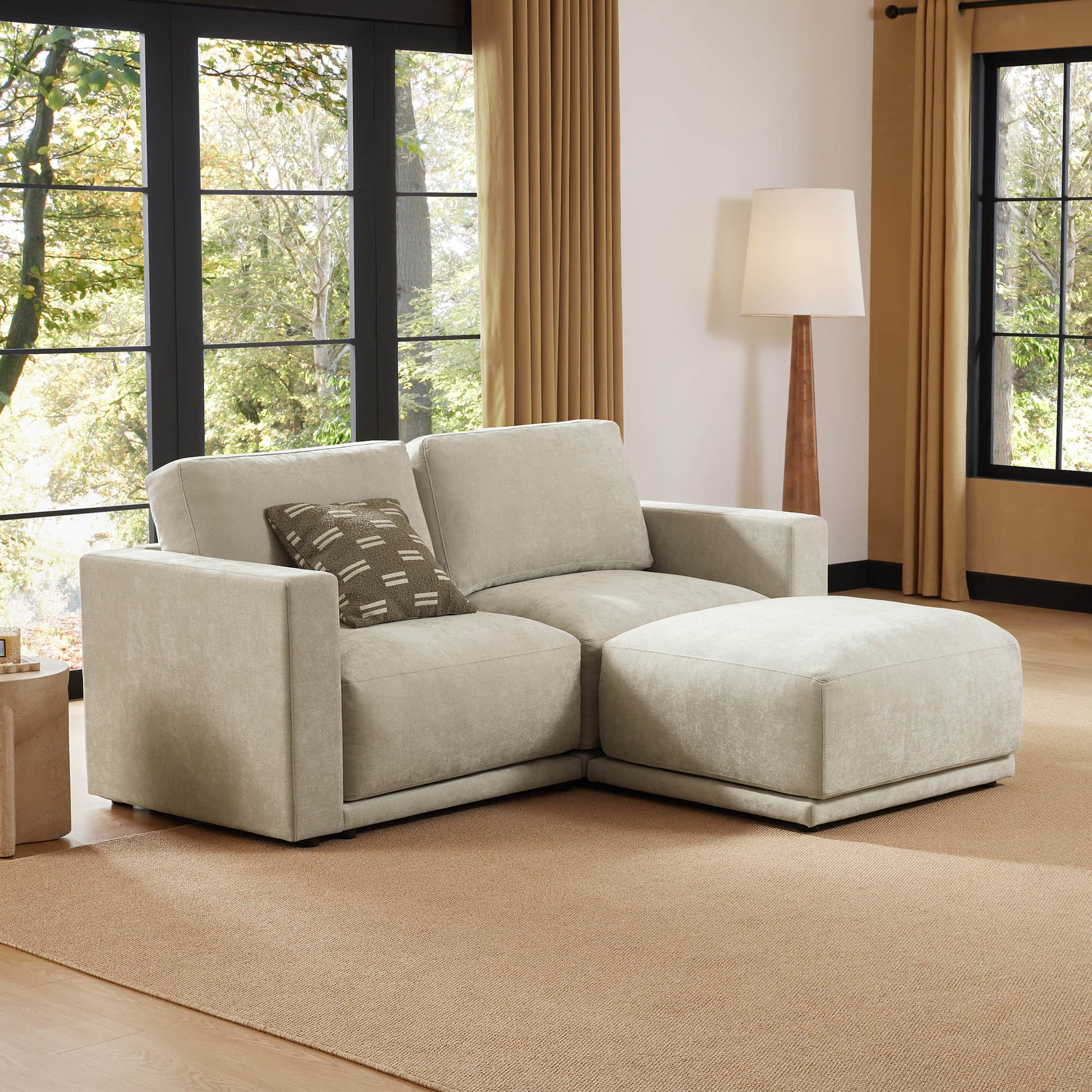 Compact sectional sofa in a bright, airy room.