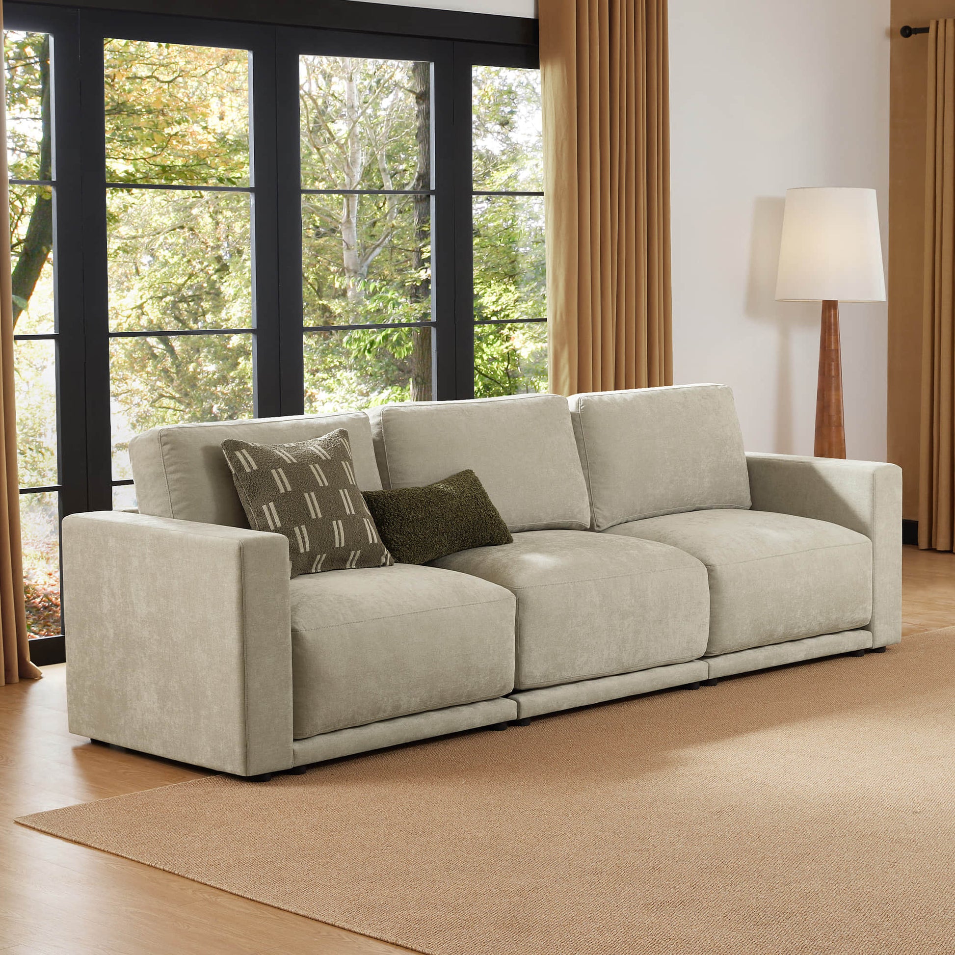Cozy modular sofa sectional with large windows.